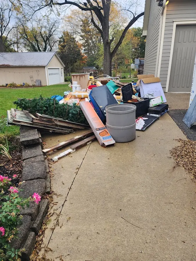 Dumpster being loaded with debris for 30 Yard Dumpster Rental in Easton